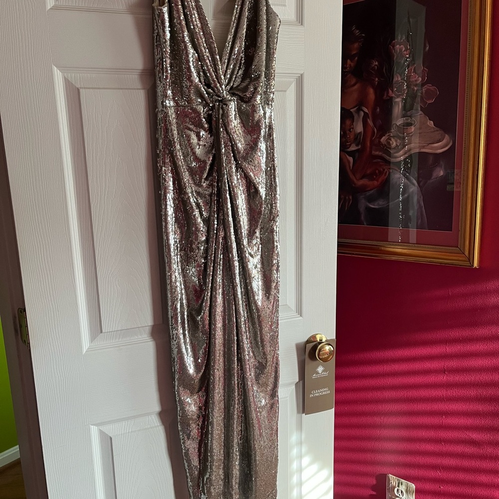Brand new with tags still on Halston sequin straight leg halter jumpsuit.